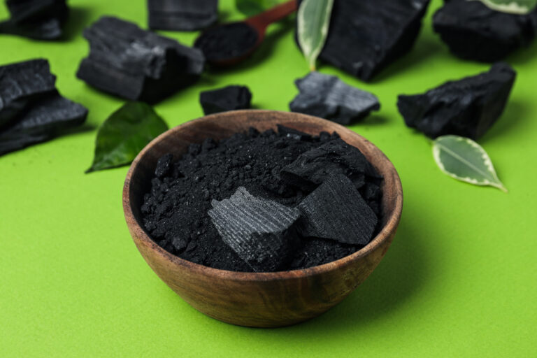natural charcoal powdered charcoal green background